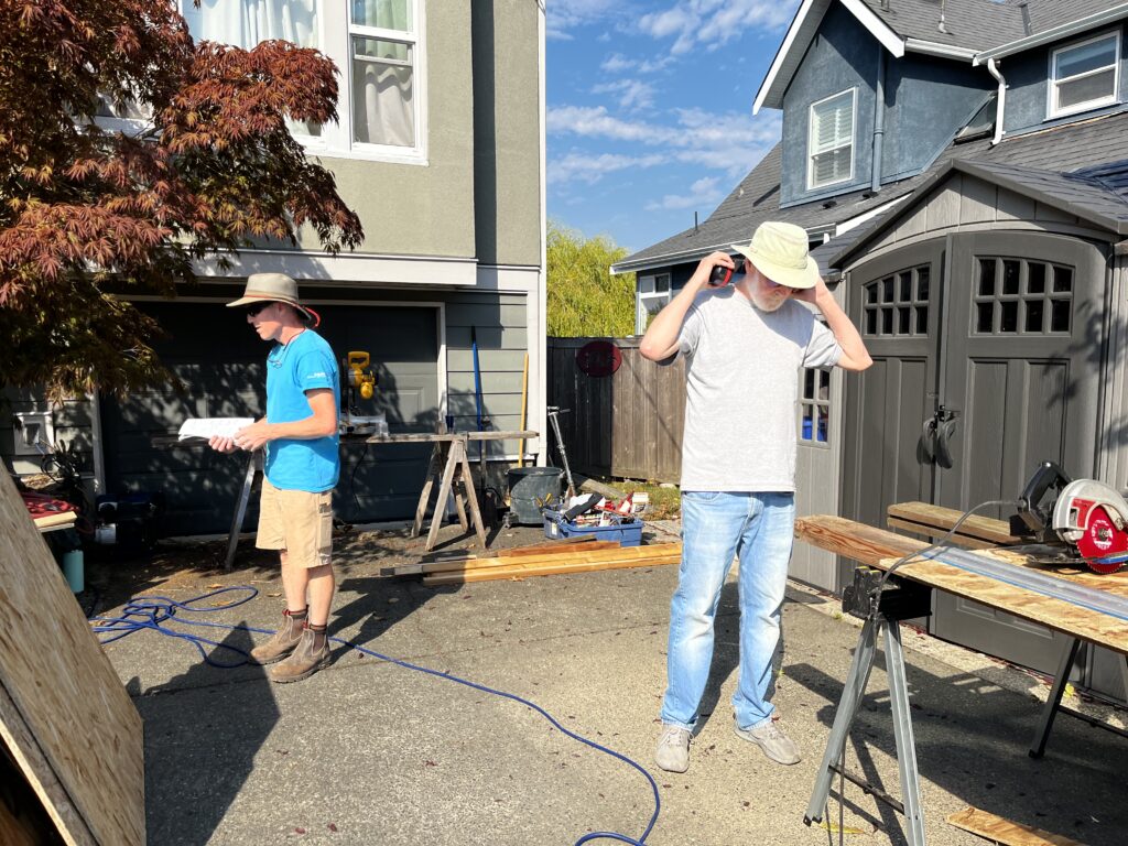 Esquimalt Men's Shed members participating in pantry building.