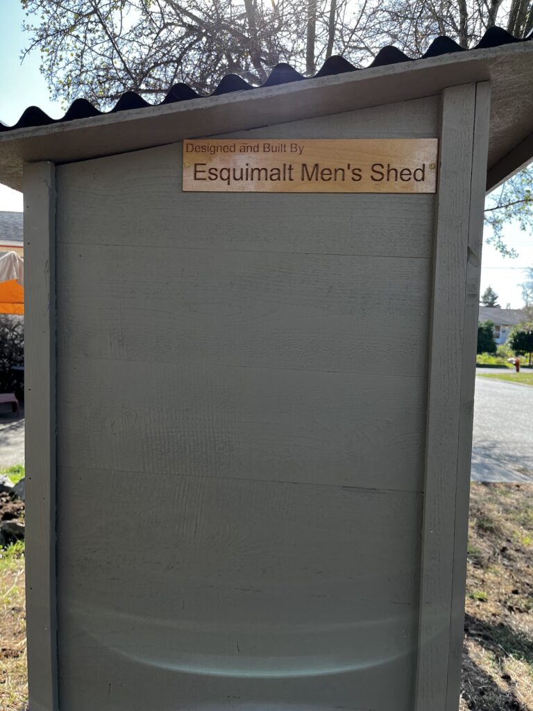 Mutual Aid pantry with EMS credit sign.