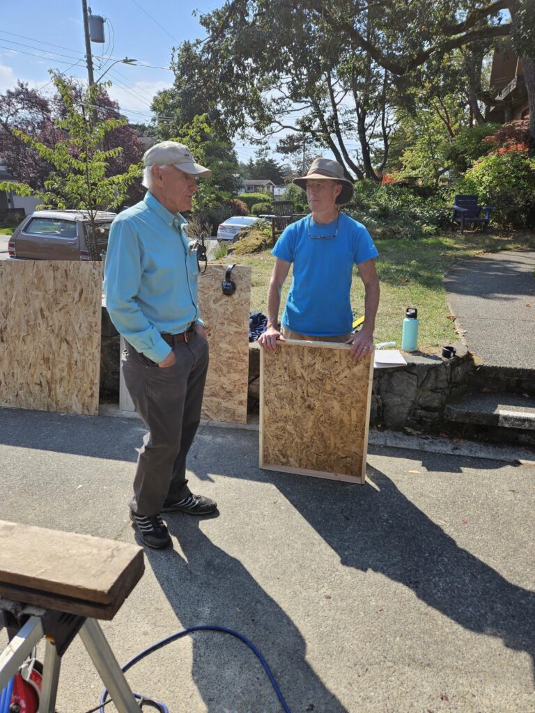 Michael and John discussing the pantry build.
